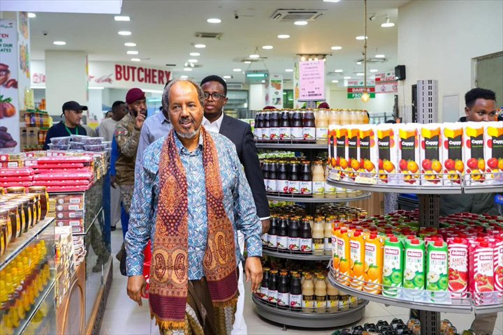 Customer shopping in a supermarket aisle, representing ResultKey retail clients